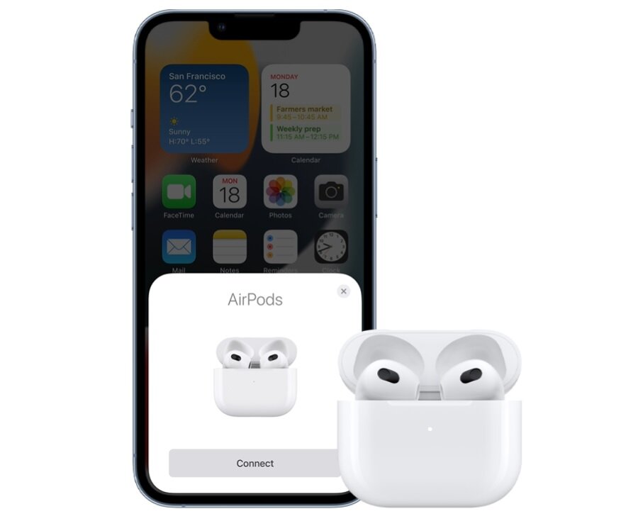 Słuchawki Apple AirPods (3 generacji) MPNY3ZM/A widok na iPhone'a i słuchawki w etui obok w trakcie łączenia