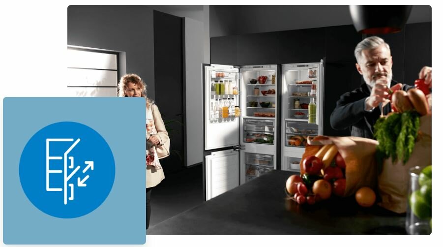 Lodówka Beko RCSA240K40WN grafika przedstawia dwie osoby w kuchni oraz otwartą lodówkę